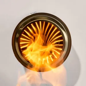 herQs rökfria eldstad med klara lågor, visad uppifrån med cirkulär metallkant och ventilerad kammare