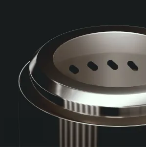 herQs Smokeless FirePit Mini close-up showing the oval fire pit opening and vent slots on dark metal